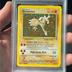 Hitmonlee Pokémon Card with Holographic Background